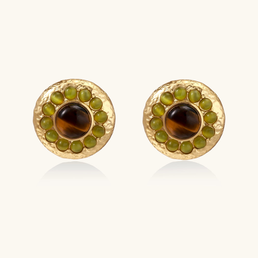 Gold-plated circular earrings featuring central tiger's eye stones surrounded by green liuli beads on textured metal base