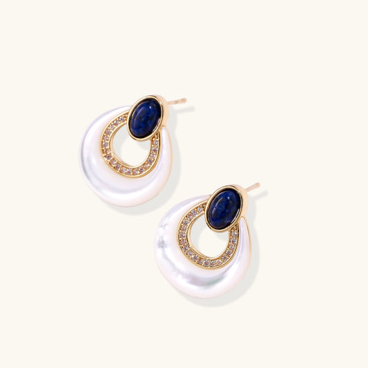 Gold-plated drop earrings featuring blue lapis lazuli ovals, diamond-studded circles, and iridescent mother of pearl teardrops