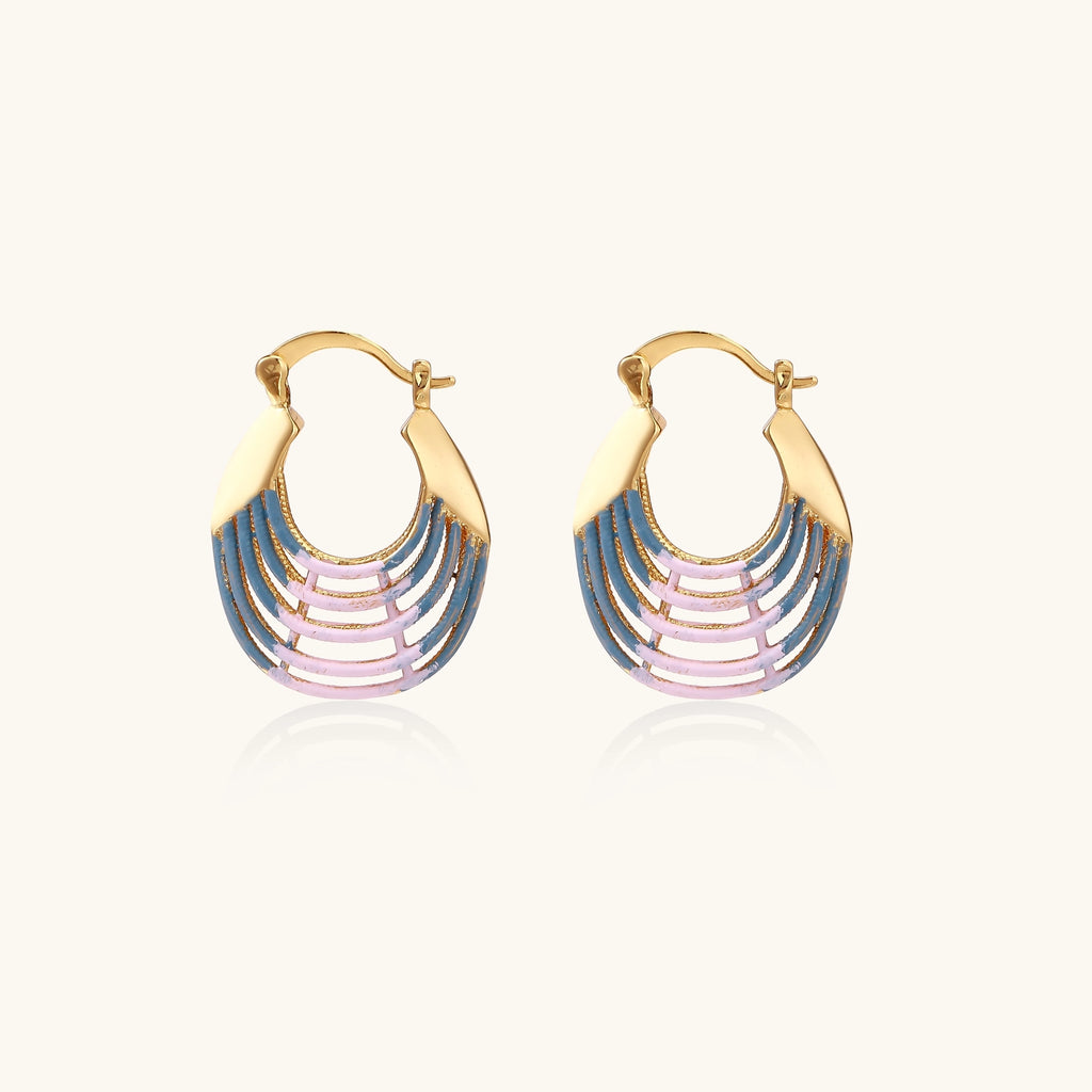Gold hoop earrings with layered blue to pink enamel in shell pattern, photographed against white background