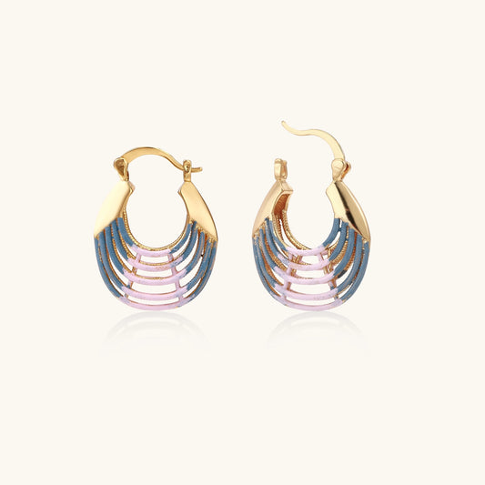 Gold hoop earrings with layered blue to pink enamel in shell pattern, photographed against white background