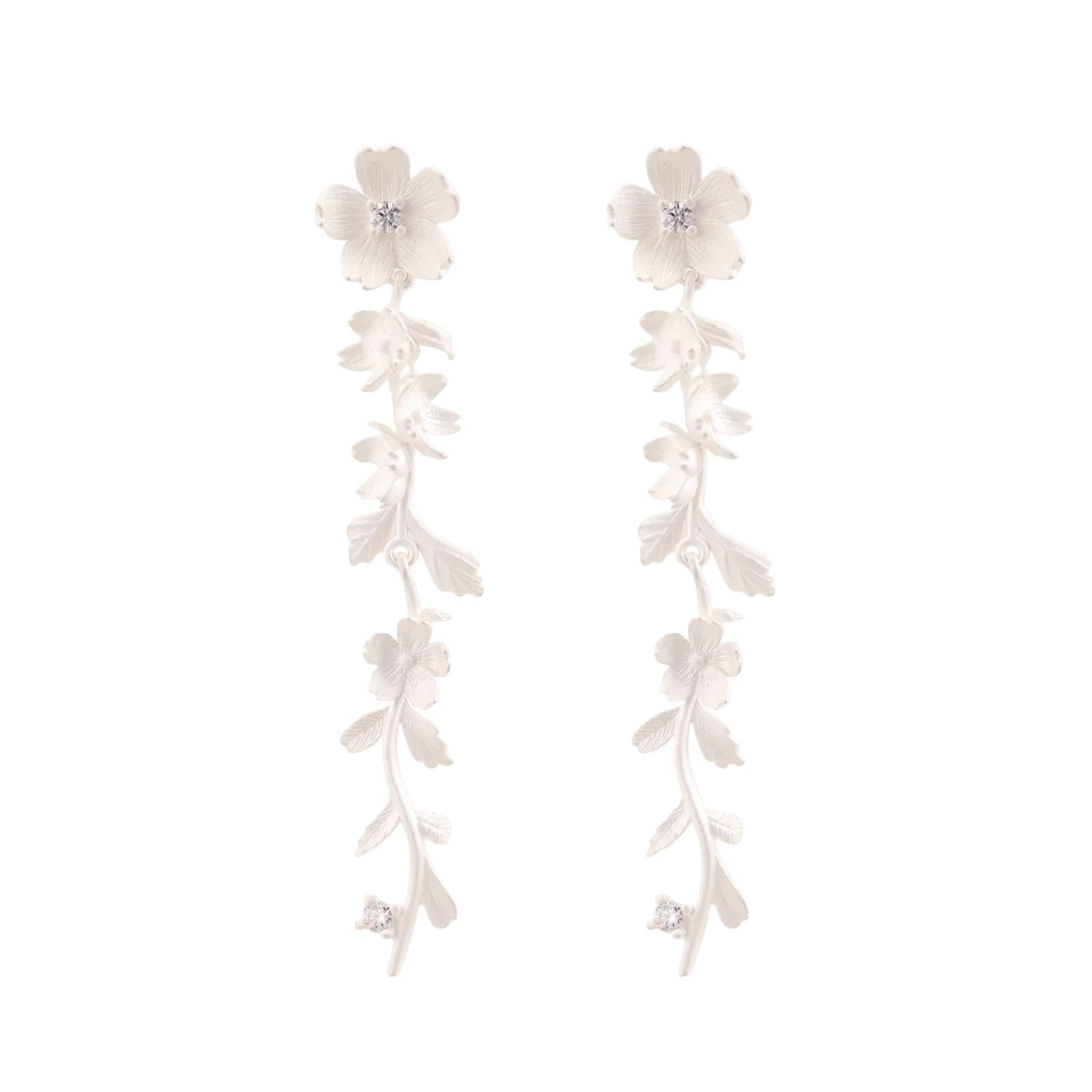 Long sterling silver drop earrings with delicate floral vine design and crystal accents on white background